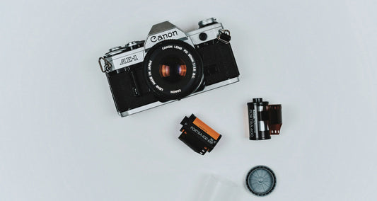 A photographic film camera.
